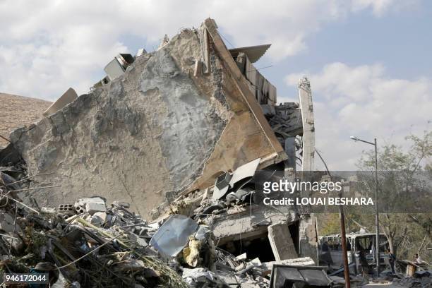 This picture taken on April 14, 2018 shows the wreckage of a building described as part of the Scientific Studies and Research Centre compound in the...