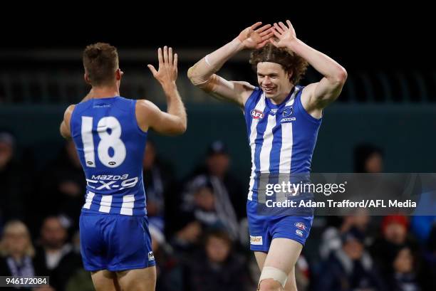 Ben Brown of the Kangaroos celebrates a goal with Shaun Atley of the Kangaroos during the 2018 AFL Round 04 match between the North Melbourne...