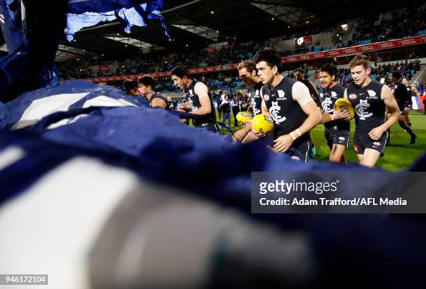 Matthew Kennedy of the Blues prepares to run through the banner during the 2018 AFL Round 04 match between the North Melbourne Kangaroos and the...