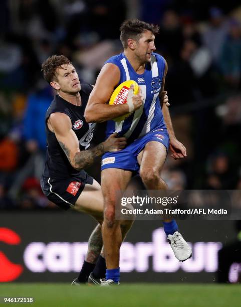 Jarrad Waite of the Kangaroos is tackled by Cameron OâShea of the Blues during the 2018 AFL Round 04 match between the North Melbourne Kangaroos and...