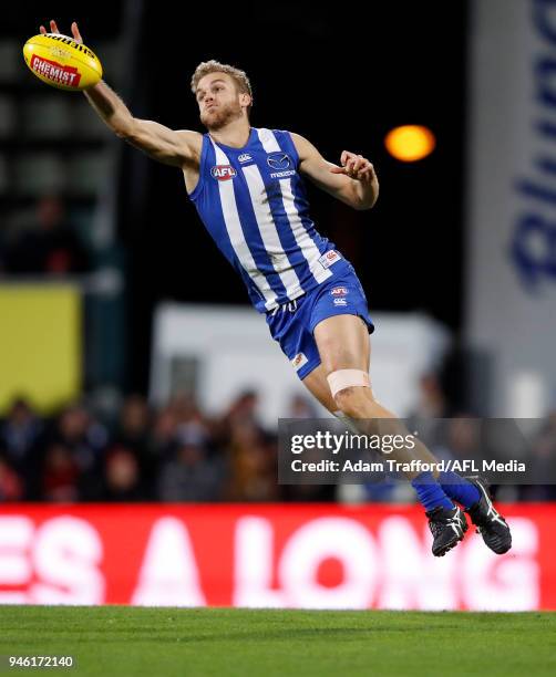 Ed Vickers-Willis of the Kangaroos reaches for the ball during the 2018 AFL Round 04 match between the North Melbourne Kangaroos and the Carlton...