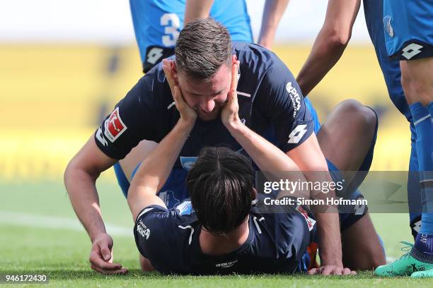 Adam Szalai of Hoffenheim celebrates with Nico Schulz of Hoffenheim after he scored a goal to make it 2:0 during the Bundesliga match between TSG...