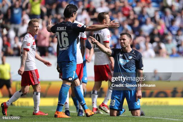 Adam Szalai of Hoffenheim celebrates with Nico Schulz of Hoffenheim after he scored a goal to make it 2:0 during the Bundesliga match between TSG...