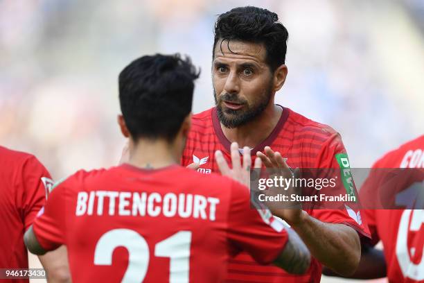 Leonardo Bittencourt of Koeln celebrates with Claudio Pizarro of Koeln after he scored a goal to make it 0:1 during the Bundesliga match between...