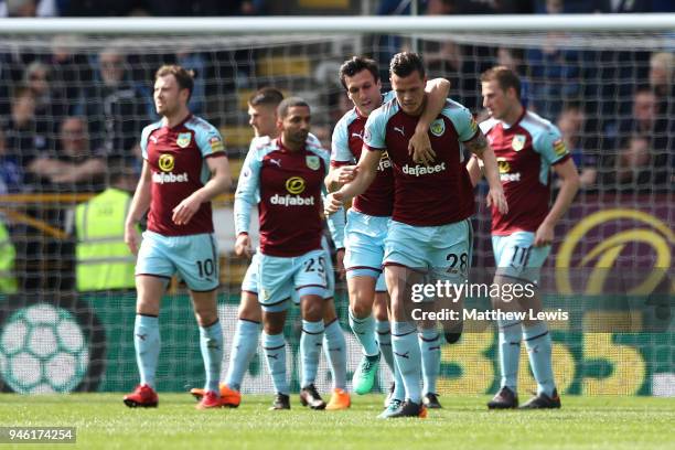 Kevin Long of Burnley celebrates with teammate Jack Cork after scoring his sides second goal during the Premier League match between Burnley and...