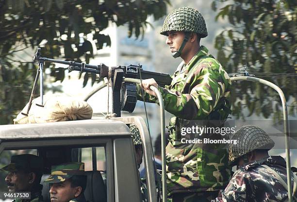 Military personel take part in an armoured patrol on the streets of Dhaka, Bangladesh, on January 8, 2007. A state of emergency was declared in Dhaka...