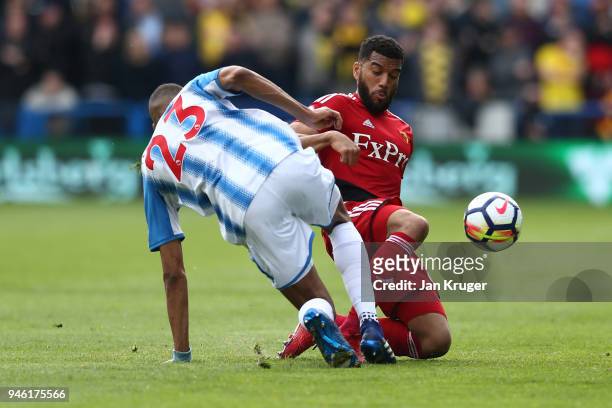 Collin Quaner of Huddersfield Town is challenged by Adrian Mariappa of Watford during the Premier League match between Huddersfield Town and Watford...