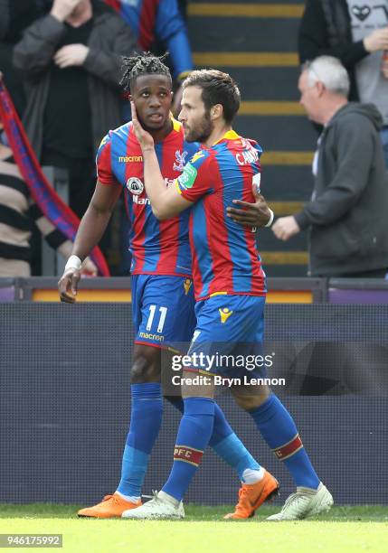 Wilfried Zaha of Crystal Palace celebrates with teammate Yohan Cabaye after scoring his sides first goal during the Premier League match between...