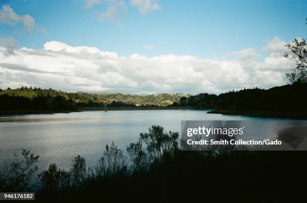 Rolling hills surround the Lafayette Reservoir on an overcast day in Lafayette, California, February 26, 2018.