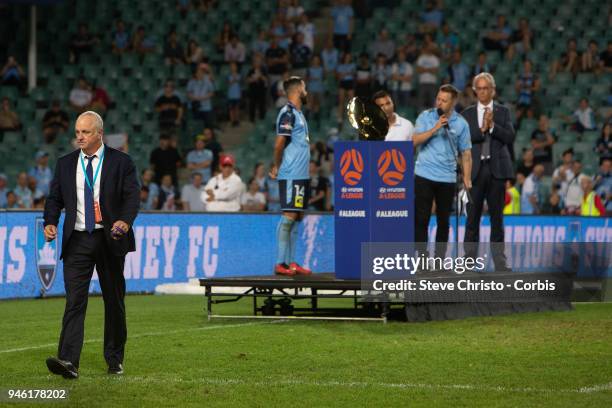 Graham Arnold of Sydney FC walks to a waiting team after making a speech during the round 27 A-League match between the Sydney FC and the Melbourne...