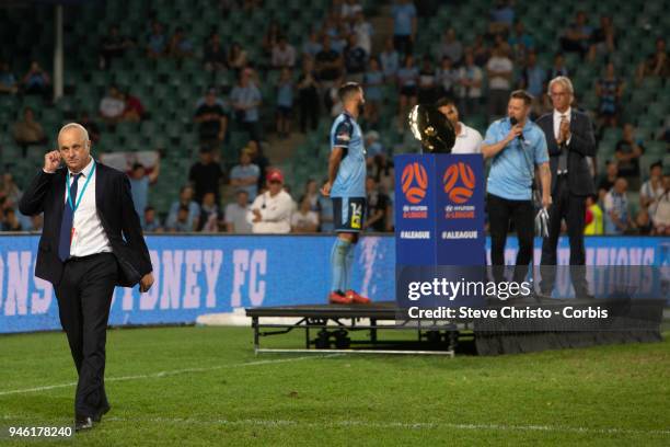 Graham Arnold of Sydney FC walks to a waiting team after making a speech during the round 27 A-League match between the Sydney FC and the Melbourne...