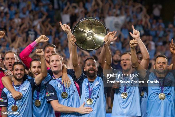 Alex Brosque of Sydney FC holds up the Premiers Plate after the round 27 A-League match between the Sydney FC and the Melbourne Victory at Allianz...