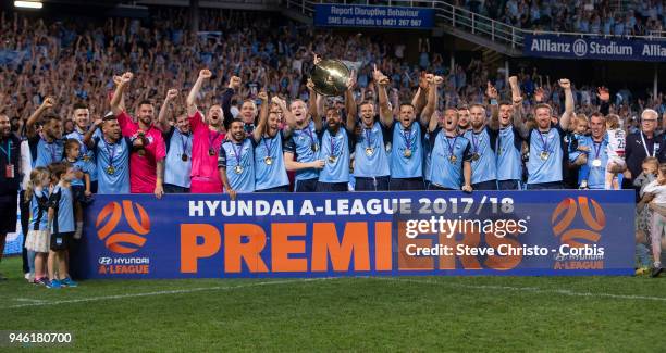 Alex Brosque of Sydney FC holds up the Premiers Plate after the round 27 A-League match between the Sydney FC and the Melbourne Victory at Allianz...