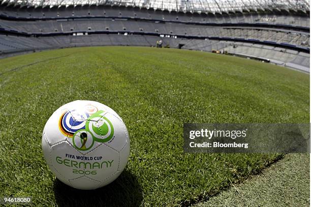 Soccer ball sits on the new turf at the Munich Allianz Arena in Munich, Germany, on Wednesday, May 17, 2006. Workers laid new grass before the start...