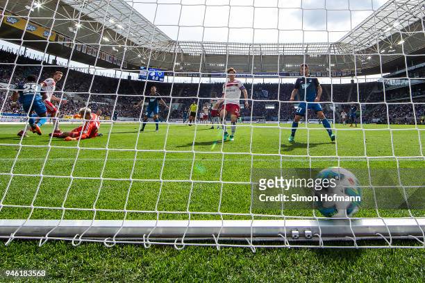 Serge Gnabry of Hoffenheim scores a goal to make it 1:0 past goalkeeper Julian Pollersbeck of Hamburg during the Bundesliga match between TSG 1899...