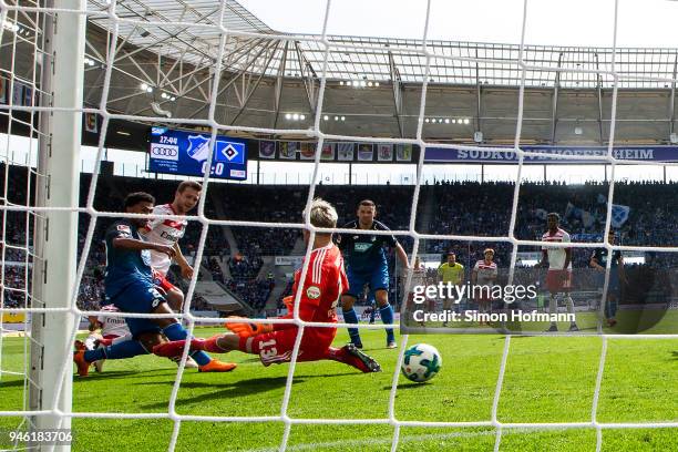 Serge Gnabry of Hoffenheim scores a goal to make it 1:0 past goalkeeper Julian Pollersbeck of Hamburg during the Bundesliga match between TSG 1899...