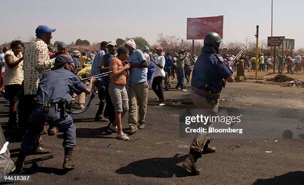 Police fire rubber bullets against demonstrators during a protest against poor service delivery in the informal settlement of Zone 1, Protea Glen,...