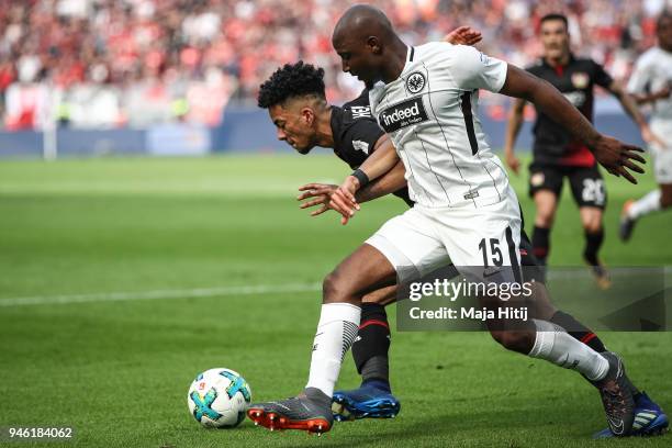 Benjamin Henrichs of Bayer Leverkusen and Jetro Willems of Eintracht Frankfurt battle for the ball during the Bundesliga match between Bayer 04...