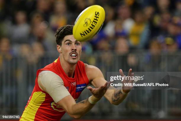 Alex Sexton of the Suns marks the ball during the round four AFL match between the West Coast Eagles and the Gold Coast Suns at Optus Stadium on...