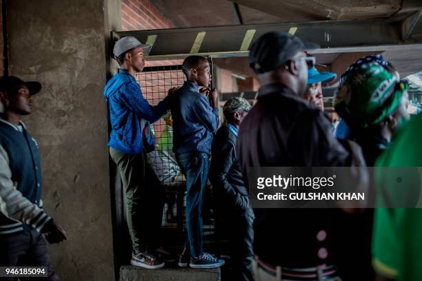 Mourners gather in the Orlando Stadium in the township of Soweto to watch the funeral of the late anti-apartheid champion Winnie Mandizikela-Mandela,...