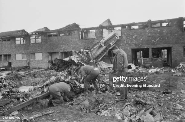 Officers inspecting the wreckage of British jet English Electric Canberra PR 9, operated by 39 Squadron Royal Air Force, which crashed on Norfolk...