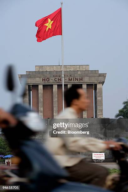 Motorcyclist passes the Ho Chi Minh Mausoleum Complex in Hanoi, Vietnam on Tuesday, August 22, 2006.