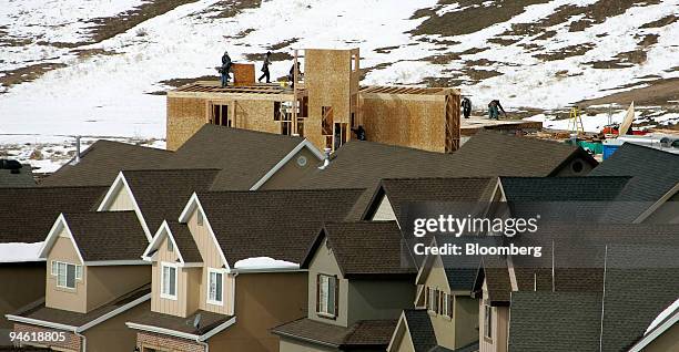 With existing homes in the foreground, construction workers work on a new home in the Traverse subdivision in Lehi, Utah Thursday, March 1, 2007. The...