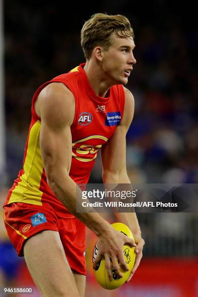 Tom Lynch of the Suns looks to kick the ball during the round four AFL match between the West Coast Eagles and the Gold Coast Suns at Optus Stadium...