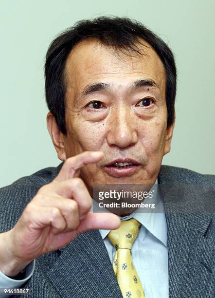 Masao Nakamura, president of NTT DoCoMo Inc., speaks to reporter during an interview at the company's headquarters in Tokyo, Japan on Wednesday,...