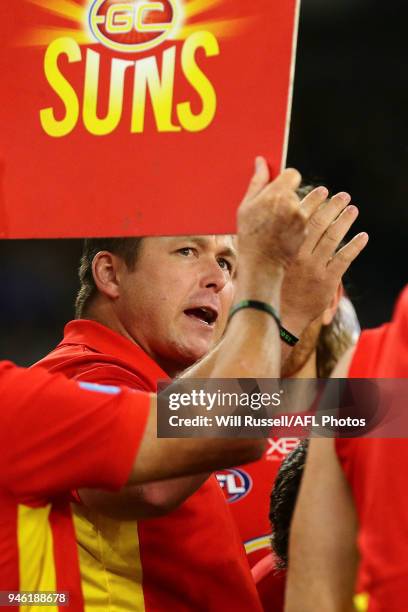 Stuart Dew, Senior Coach of the Suns, addresses the players at the three-quarter time break during the round four AFL match between the West Coast...