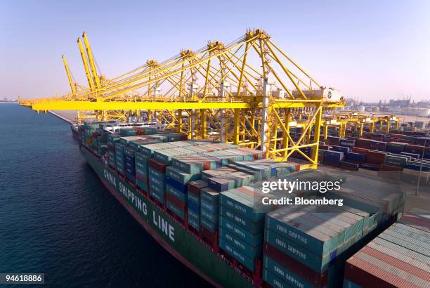 Container ship owned by China Shipping Container Lines Co. Ltd. Is loaded at Jebel Ali Port, in Dubai, United Arab Emirates, on Wednesday, Dec. 26,...