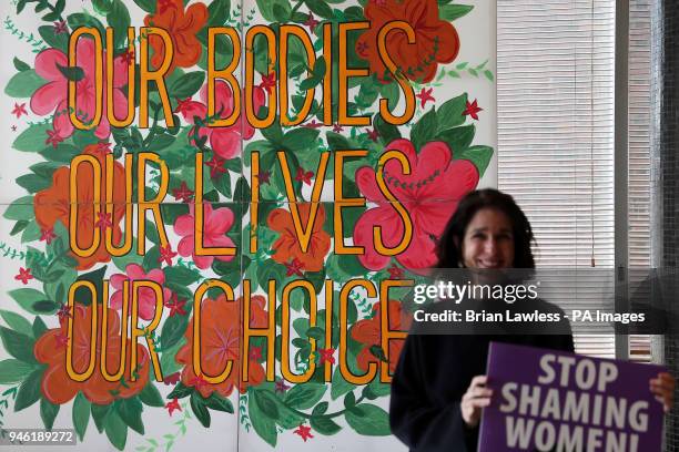 People attend at a rally for Equality, Freedom &amp; Choice organised by ROSA - Socialist Feminist Movement at Liberty Hall in Dublin.