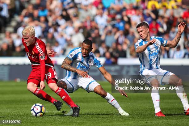 Will Hughes of Watford and Rajiv Van La Parra of Huddersfield Town during the Premier League match between Huddersfield Town and Watford at John...
