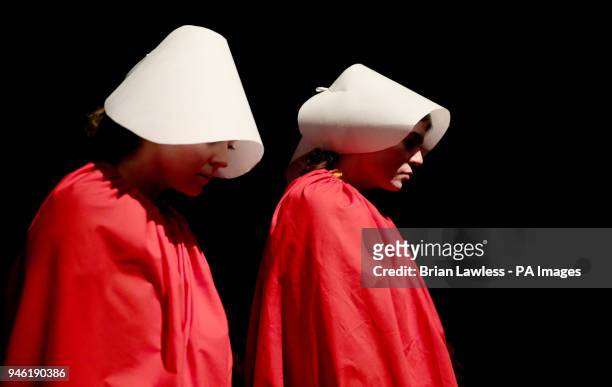 Activists dressed as 'Handmaids' at a rally for Equality, Freedom &amp; Choice organised by ROSA - Socialist Feminist Movement at Liberty Hall in...