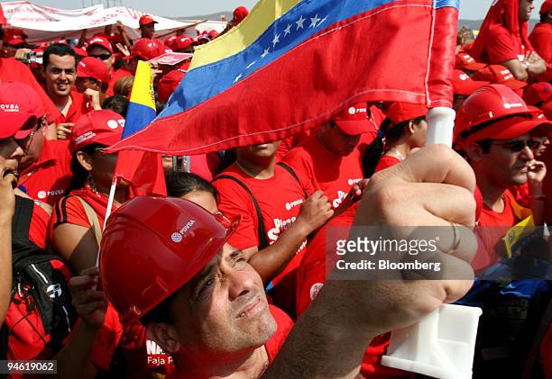 Supporter of Venezuelan President Hugo Chavez waves a national flag during a speech by the President at the Jose Antonio Anzotegui oil complex in...