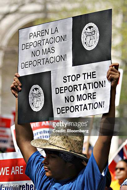 Demonstrators holds a sign during a rally in support of immigrant rights in Washington Square Park, Tuesday, May 1, 2007 in New York.