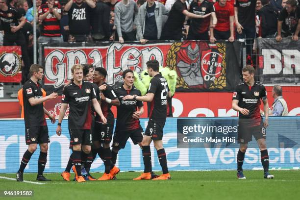 Kevin Volland of Bayer Leverkusen celebrates with his team-mates after scoring his teams second goal to make it 2-1 during the Bundesliga match...