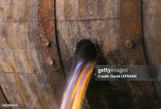 Disgorging barrels. The barrels used are new, as opposed to those used by Scottish and Irish distillators. This step in the maturation process allows...