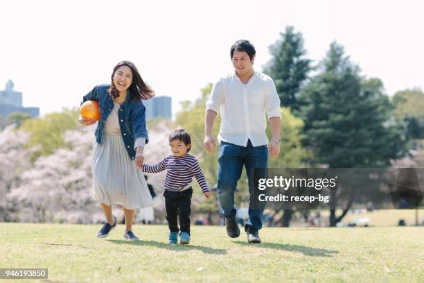 japanese family enjoying their time in spring - family full length stock pictures, royalty-free photos & images