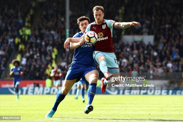 Ashley Barnes of Burnley is challenged by Harry Maguire of Leicester City during the Premier League match between Burnley and Leicester City at Turf...