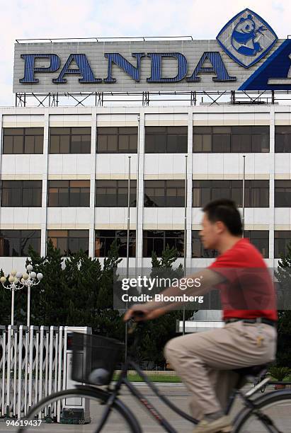 Man rides his bicycle past Nanjing Panda Electronics Co. Ltd. Headquarters in Nanjing, Jiangsu province, China, Sunday, August 20, 2006. Nanjing...