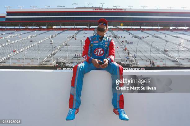 Darrell Wallace Jr., driver of the STP Chevrolet, sits on pit wall prior to the start of practice for the Monster Energy NASCAR Cup Series Food City...