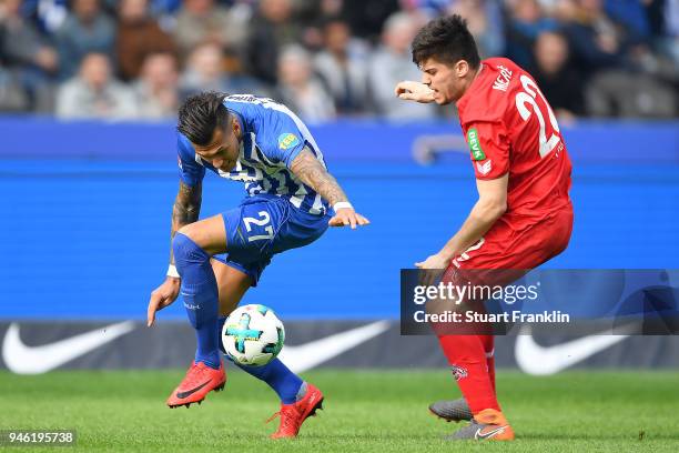 Davie Selke of Berlin fights for the ball with Jorge Mere of Koeln during the Bundesliga match between Hertha BSC and 1. FC Koeln at Olympiastadion...
