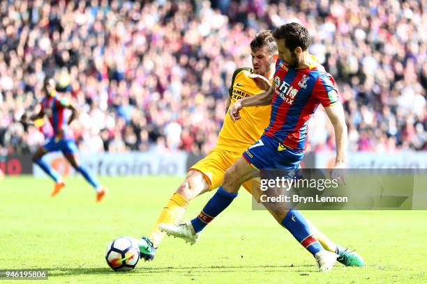 Pascal Gross of Brighton and Hove Albion tackles Yohan Cabaye of Crystal Palace during the Premier League match between Crystal Palace and Brighton...