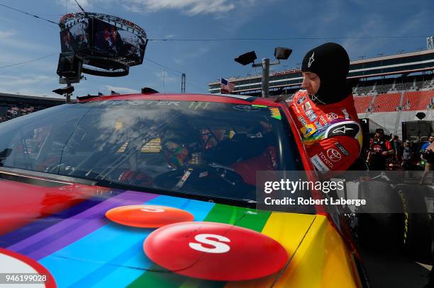 Kyle Busch, driver of the Skittles Toyota, gets into his car during practice for the Monster Energy NASCAR Cup Series Food City 500 at Bristol Motor...