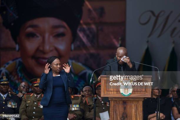 Firebrand opposition politician Julius Malema, leader of the Economic Freedom Fighters, reacts as he speaks during the funeral of anti-apartheid...