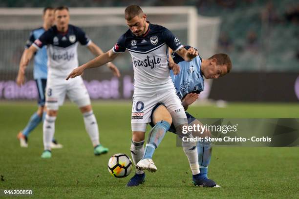 James Troisi of Melbourne is tackled by Sydney's Brandon O'Neill during the round 27 A-League match between the Sydney FC and he Melbourne Victory at...