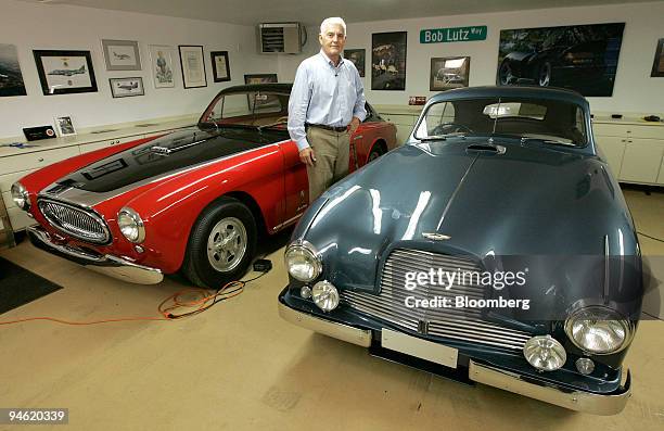 Bob Lutz, General Motor Corp. Vice Chairman of Global Product Development, stands between a 1952 Cunningham C3, left, and a 1952 Aston Martin DB2...