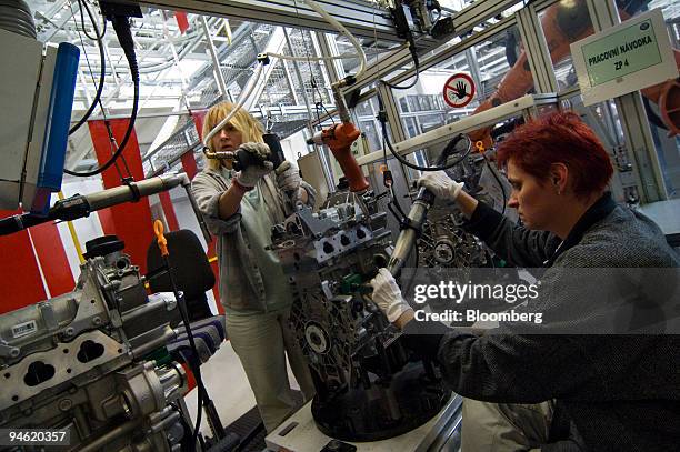 Workers assemble engines at the Skoda plant in Mlada Boleslav, Czech Republic, Thursday, October 19, 2006.