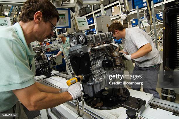 Workers assemble engines at the Skoda plant in Mlada Boleslav, Czech Republic, Thursday, October 19, 2006.